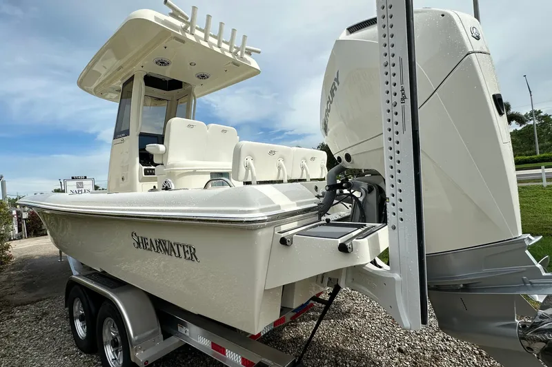 Slide: The Image of 2026 ShearWater 270 SS Open boat on trailer, featuring powerful Mercury engine. - 4