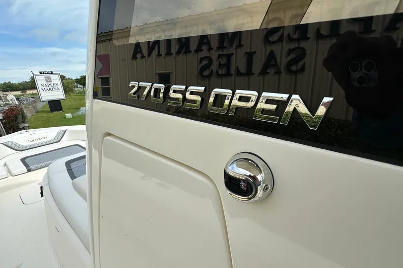 Slide: The Image of 2026 ShearWater 270 SS Open boat at Naples Marina, showcasing sleek design. - 9