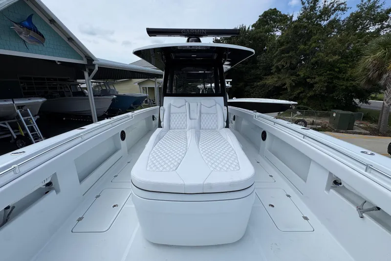 Slide: The Image of 2026 Invincible 40 Catamaran with sleek white seating and modern design. - 21