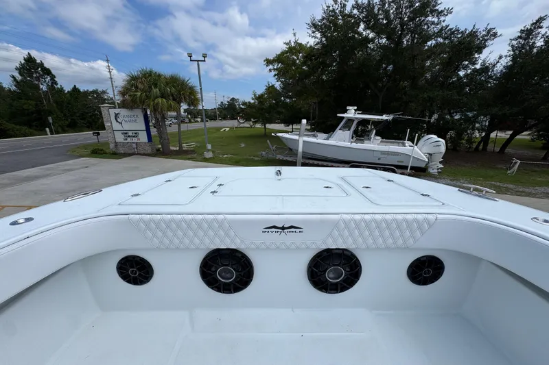 Slide: The Image of 2026 Invincible 40 Catamaran at marina, showcasing sleek design and spacious deck. - 23