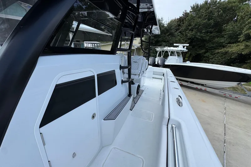 Slide: The Image of 2026 Invincible 40 Catamaran docked, showcasing sleek design and spacious deck layout. - 25