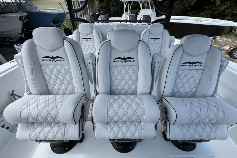 Slide: The Image of Luxurious seating on 2026 Invincible 40 Catamaran, featuring diamond-stitched white upholstery. - 30