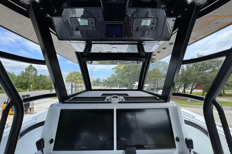Slide: The Image of 2026 Invincible 40 Catamaran cockpit with advanced navigation displays and controls. - 34