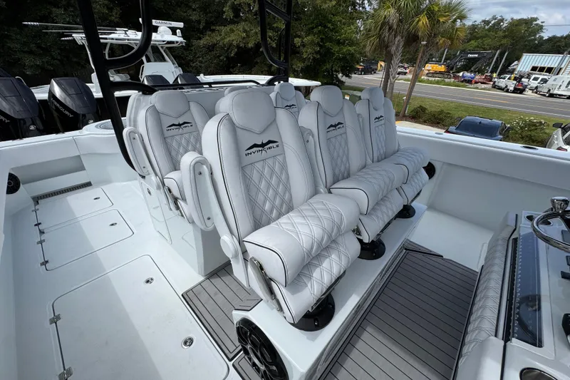 Slide: The Image of Luxurious seating on 2026 Invincible 40 Catamaran, featuring elegant white upholstery and modern design. - 35