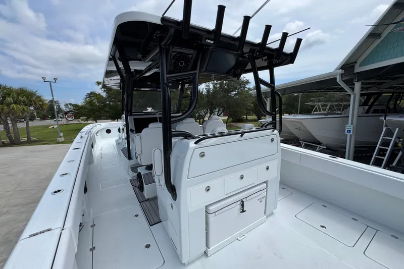 Slide: The Image of 2026 Invincible 40 Catamaran, sleek design, spacious deck, modern amenities, docked outdoors. - 37