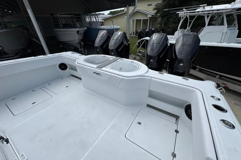 Slide: The Image of 2026 Invincible 40 Catamaran with spacious deck and powerful outboard engines. - 41