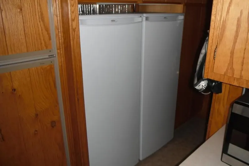 Slide: The Image of Two white refrigerators in a wooden interior, Boatel Hercules Custom 1985. - 5