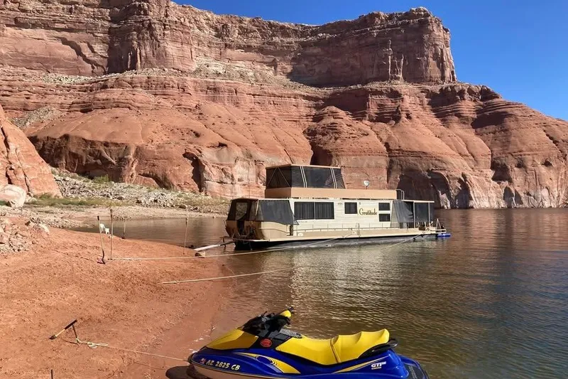 Slide: The Image of Houseboat "Gratitude" on serene lake with red rock cliffs, Boatel Hercules Custom 1985. - 8