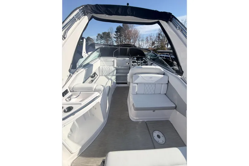 Slide: The Image of 2019 Regal 28 Express boat interior with white seating and modern dashboard. - 14