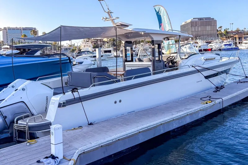 Slide: The Image of 2023 Nimbus Tender 11 docked at marina, featuring sleek design and modern amenities. - 18