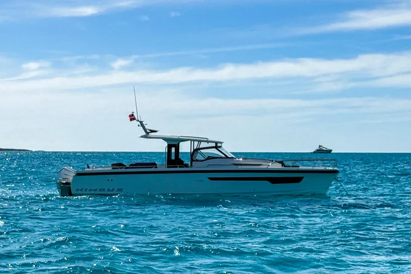 Slide: The Image of 2023 Nimbus Tender 11 boat on clear blue ocean under a sunny sky. - 36