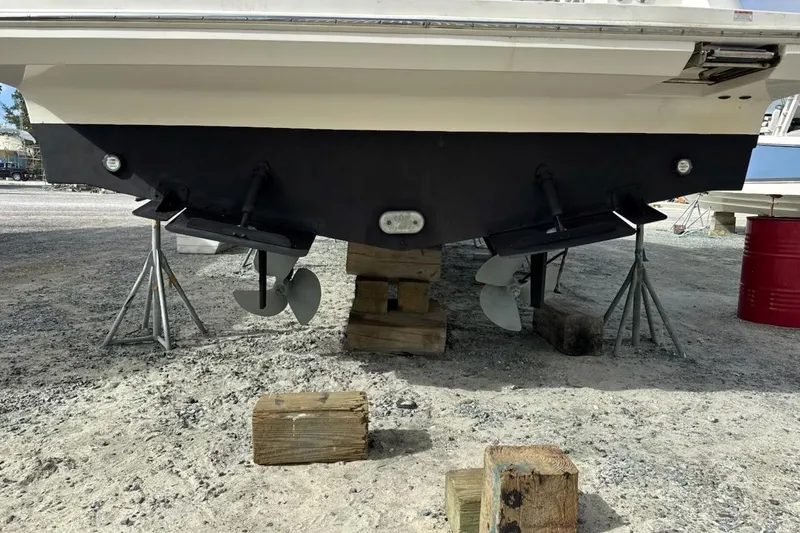 Slide: The Image of 2020 Carver 36 Command Bridge boat on stands, showing propellers and hull. - 117