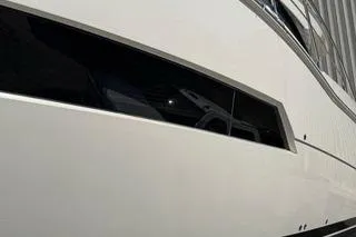 Slide: The Image of 2020 Carver 36 Command Bridge yacht, sleek white exterior with modern design. - 124