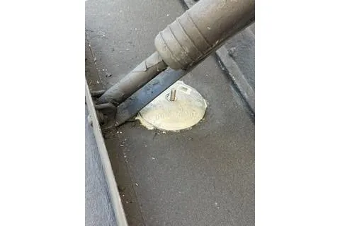 Slide: The Image of Close-up of a 2020 Carver 36 Command Bridge component with visible wiring and sealant. - 128