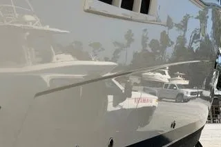 Slide: The Image of 2020 Carver 36 Command Bridge yacht with sleek exterior design in marina setting. - 122