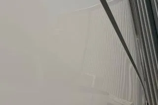 Slide: The Image of Foggy view of a Carver 36 Command Bridge yacht, 2020 model, partially obscured. - 123