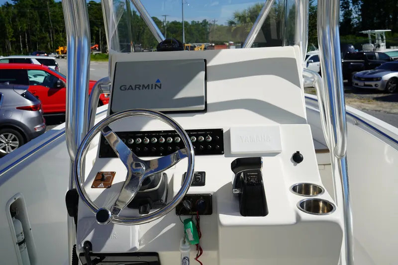 Slide: The Image of 2014 Edgewater 245CC boat console with Garmin display and Yamaha controls. - 26
