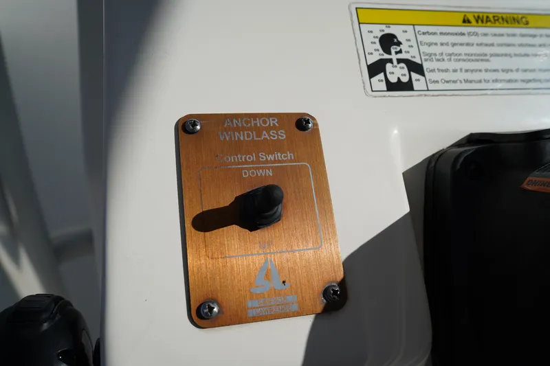 Slide: The Image of Anchor windlass control switch on 2014 Edgewater 245CC boat dashboard. - 28