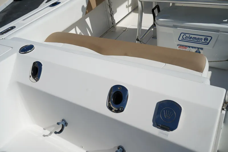 Slide: The Image of 2014 Edgewater 245CC boat interior with seating and Coleman cooler. - 7