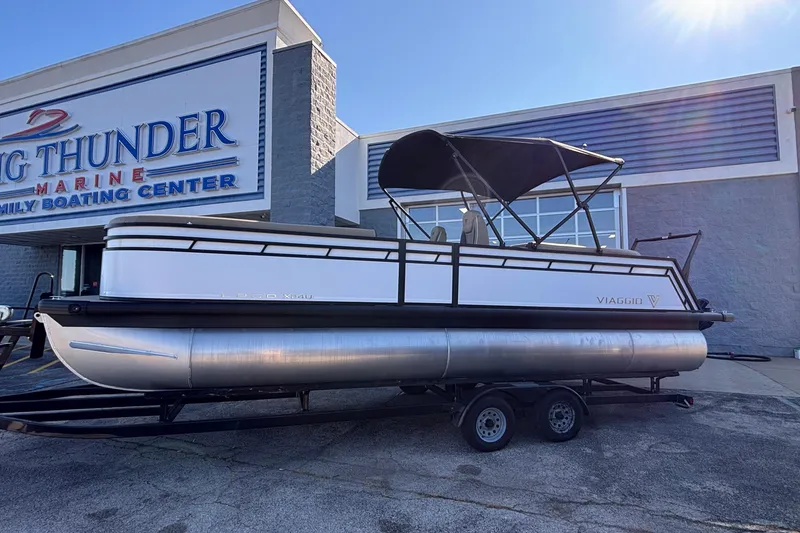 Slide: The Image of 2026 Viaggio Z24U pontoon boat on trailer at Big Thunder Marine center. - 1