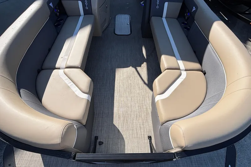 Slide: The Image of Interior of 2026 Viaggio Z24U boat with beige seating and gray flooring. - 13