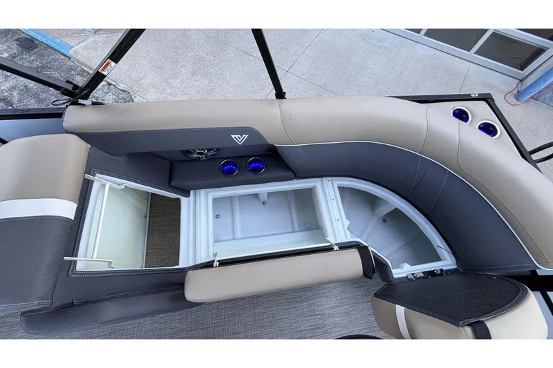 Slide: The Image of Interior view of 2026 Viaggio Z24U boat with open storage compartments and cup holders. - 17