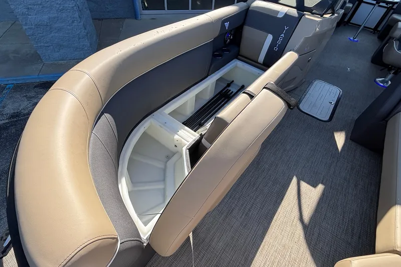 Slide: The Image of 2026 Viaggio Z24U boat interior with open storage compartment and beige seating. - 26