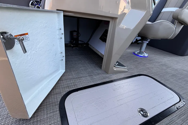 Slide: The Image of Open storage compartment in Viaggio Z24U boat, 2026 model, with visible seating and flooring. - 28