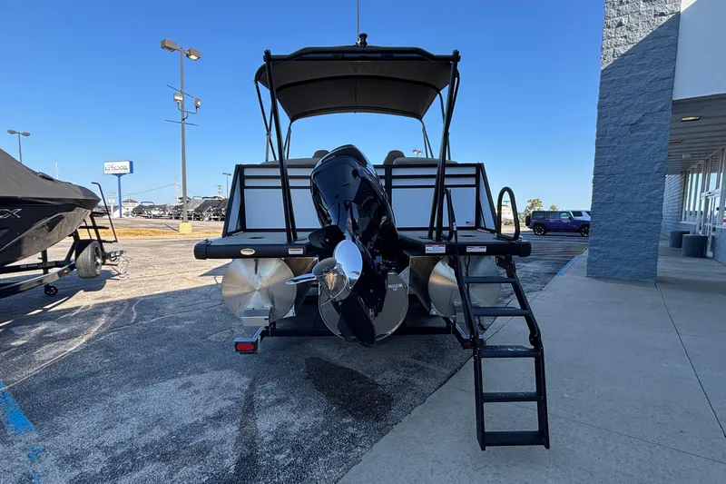 Slide: The Image of 2026 Viaggio Z24U pontoon boat with outboard motor and ladder, displayed outdoors. - 31