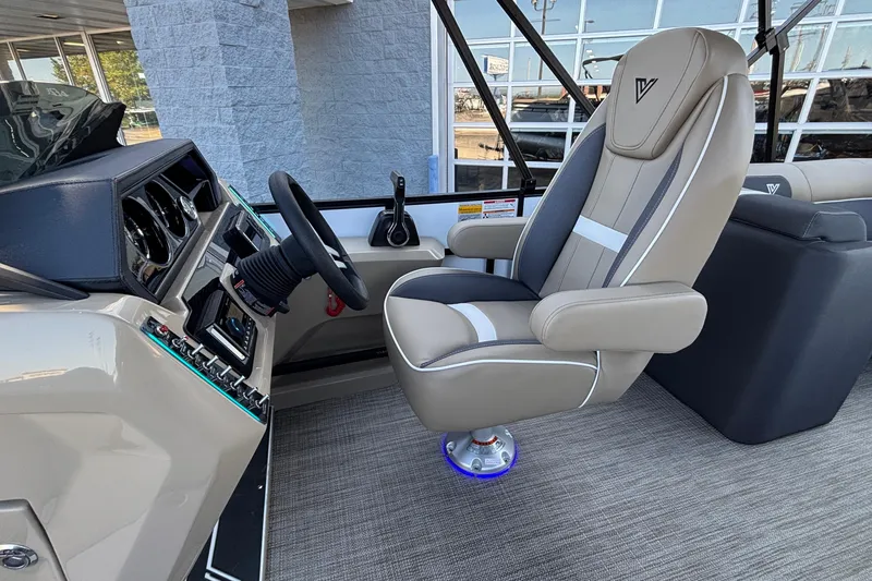 Slide: The Image of Captain's chair and dashboard of 2026 Viaggio Z24U boat, featuring modern controls. - 8