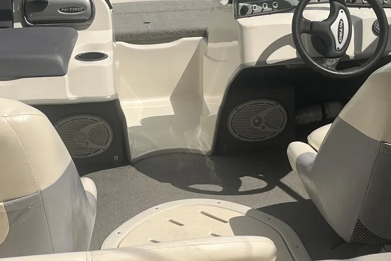 Slide: The Image of Interior of a 2009 Nitro 189 Sport boat, featuring seats and steering wheel. - 1