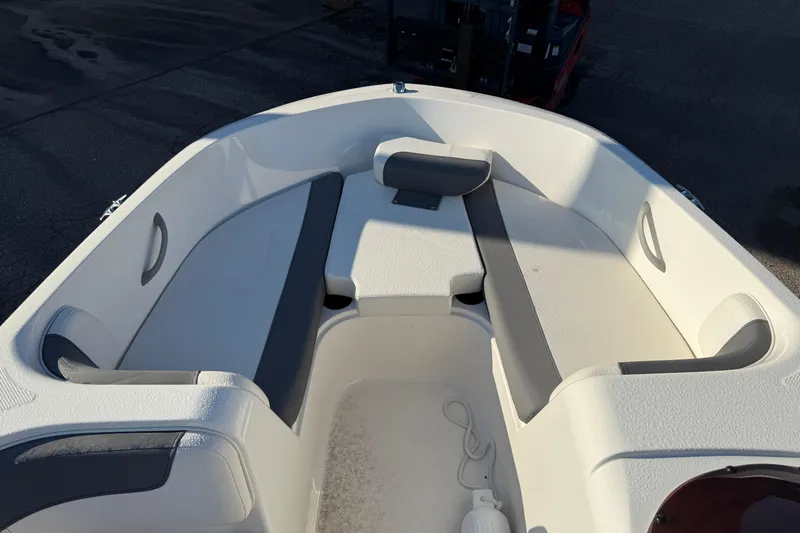Slide: The Image of 2023 Bayliner Element E18 boat interior with white and gray seating. - 10