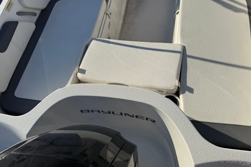 Slide: The Image of 2023 Bayliner Element E18 boat interior with seating and branding. - 9