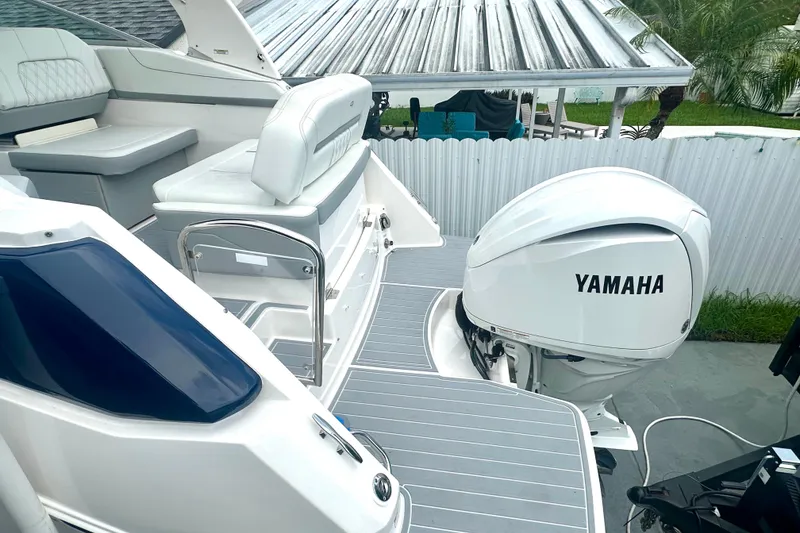 Slide: The Image of 2025 Regal 26 XO boat with Yamaha outboard engine, featuring sleek seating and modern design. - 10