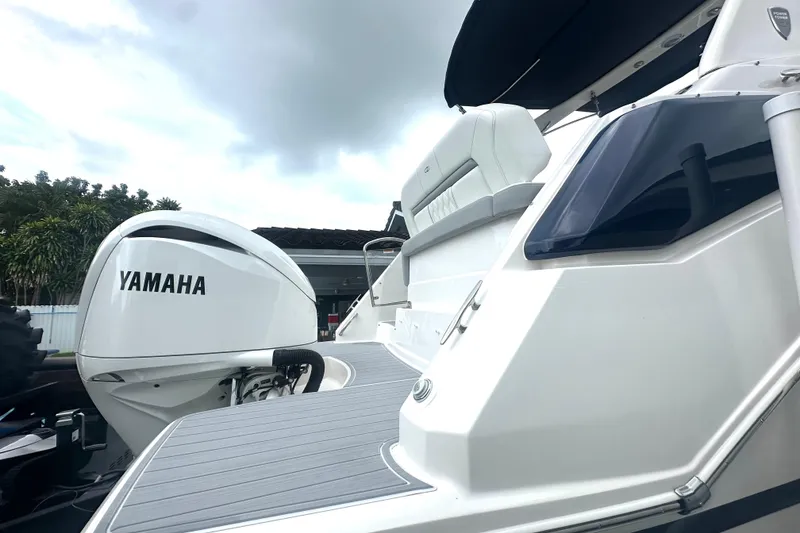 Slide: The Image of 2025 Regal 26 XO boat with Yamaha outboard motor, sleek design, and modern features. - 21