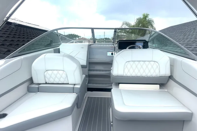 Slide: The Image of 2025 Regal 26 XO boat interior with modern seating and sleek design. - 27