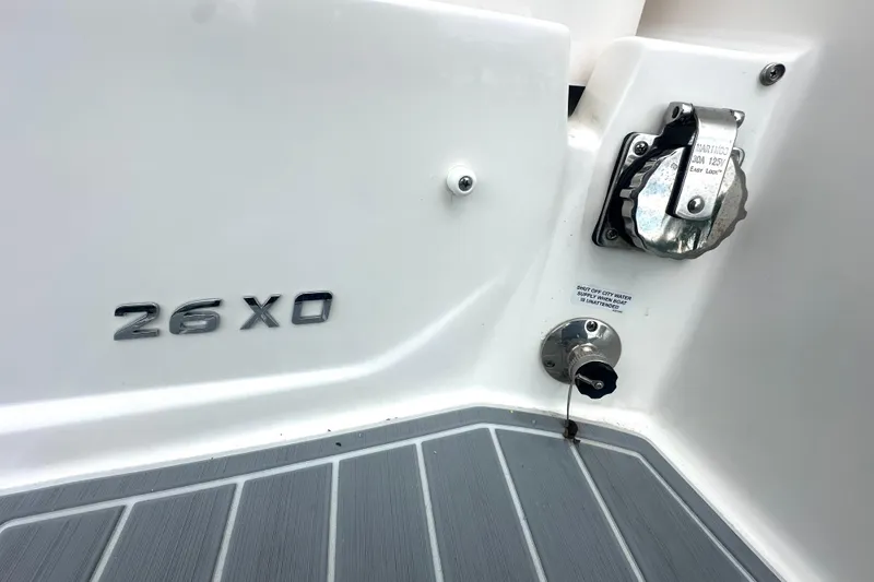 Slide: The Image of 2025 Regal 26 XO boat detail showing model name and utility connections. - 35