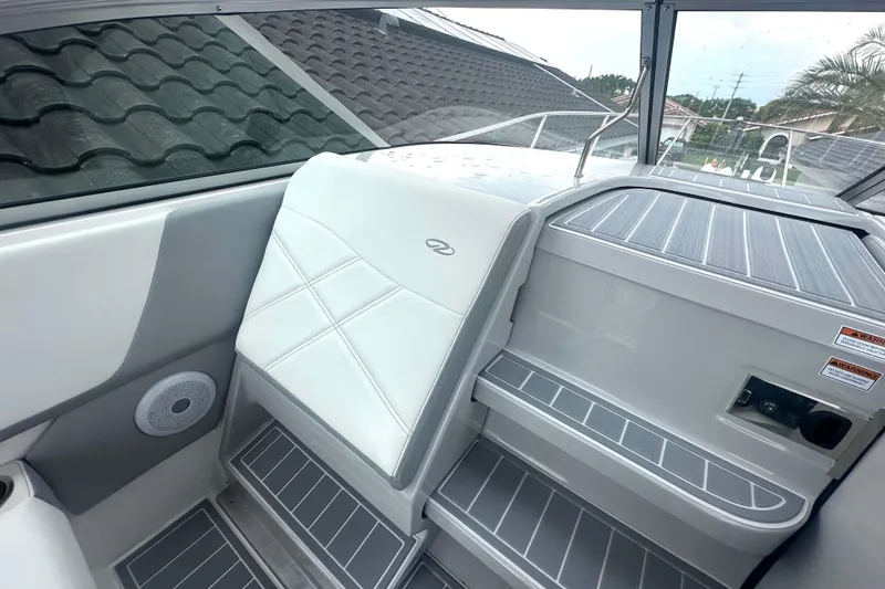 Slide: The Image of 2025 Regal 26 XO boat interior with sleek seating and modern design elements. - 37