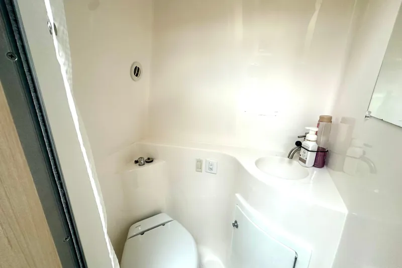 Slide: The Image of 2025 Regal 26 XO boat bathroom with compact toilet and sink. - 53