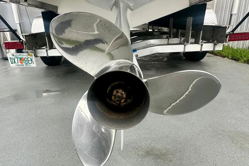Slide: The Image of Propeller of a 2025 Regal 26 XO boat on a trailer, Florida license plate visible. - 56