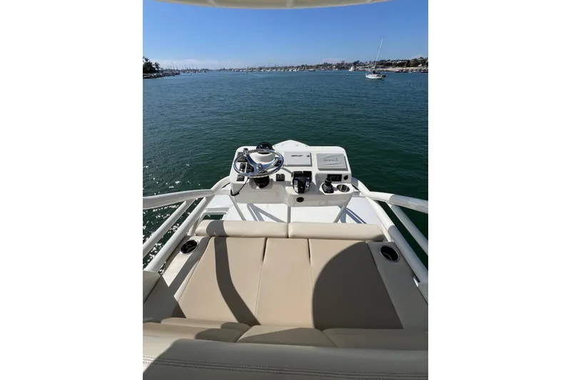 Slide: The Image of 2019 Boston Whaler 380 Outrage helm view on open water. - 17