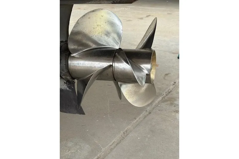 Slide: The Image of Stainless steel propeller of a 2012 Regal 2500 Bowrider boat on concrete surface. - 16