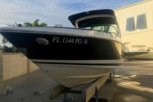 Slide: The Image of 2012 Regal 2500 Bowrider boat on trailer, side view, sunny day. - 4