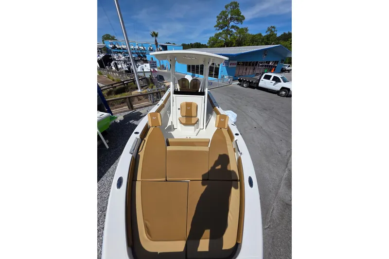 Slide: The Image of Ranger 2660 Bay 2026 boat seats with tan leather and diamond stitching design. - 13