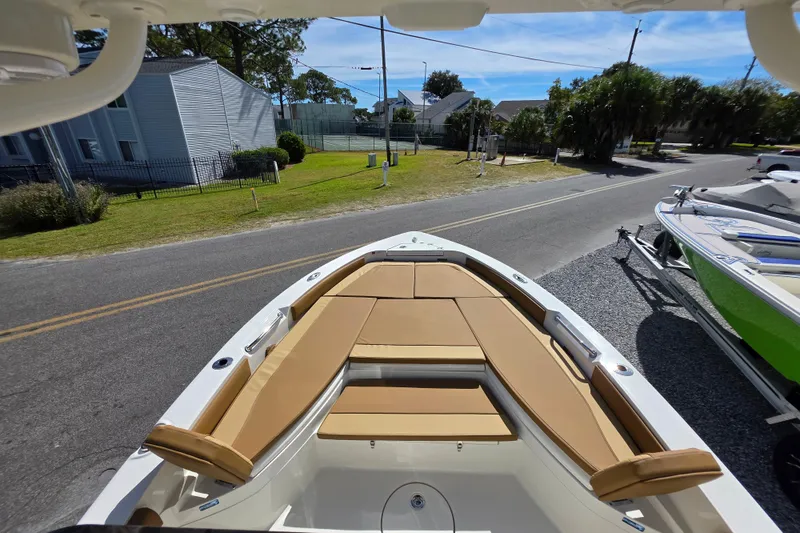 Slide: The Image of Open storage compartment on 2026 Ranger 2660 Bay boat, featuring organized interior shelves. - 21