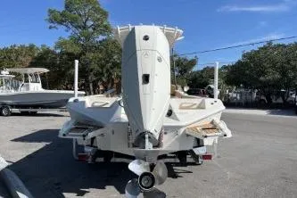 Slide: The Image of 2026 Ranger 2660 Bay boat on trailer outside a blue building. - 3