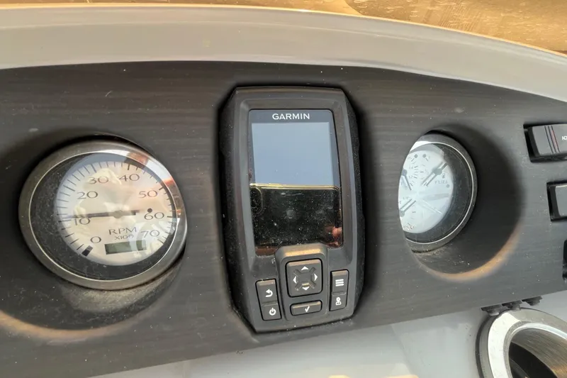 Slide: The Image of Dashboard of 2021 Bennington 21 SSBX with Garmin display and gauges. - 14