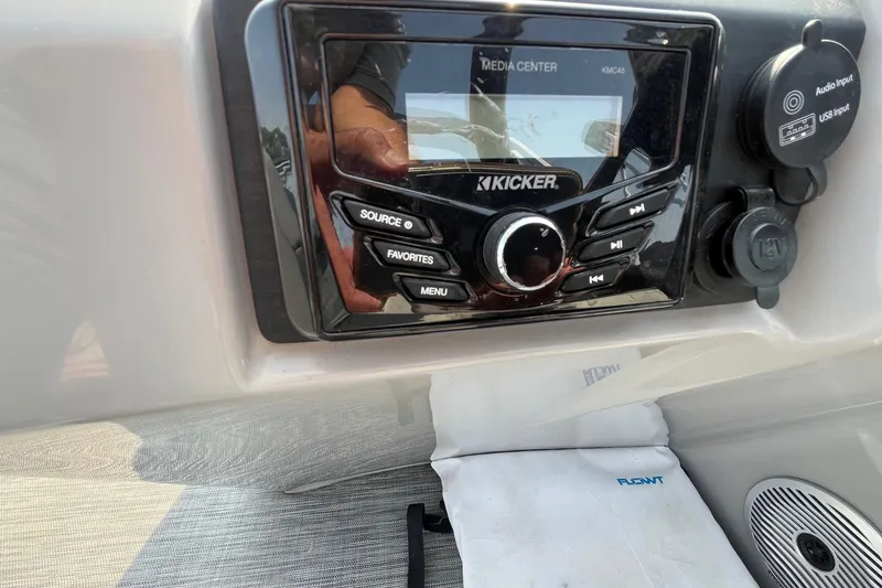 Slide: The Image of Kicker media center on 2021 Bennington 21 SSBX boat dashboard with audio controls. - 15