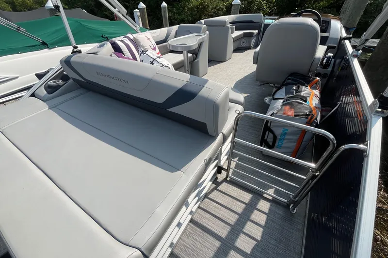 Slide: The Image of 2021 Bennington 21 SSBX pontoon boat interior with seating and storage. - 9