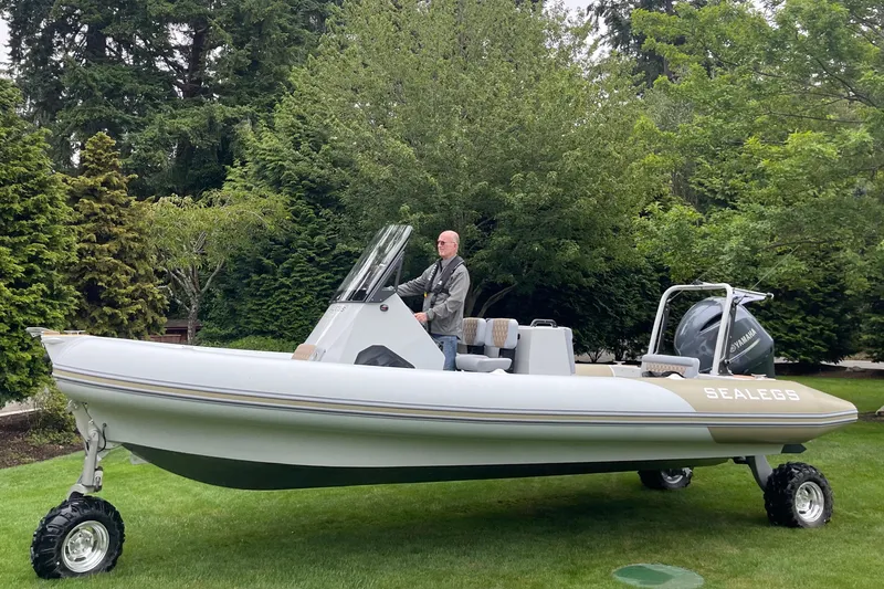 The Image of 2022 Sealegs 7.5M amphibious boat on grass with trees in background. - 0